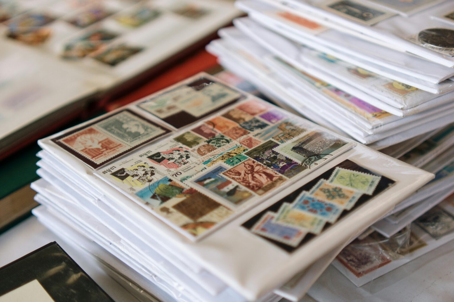 A detailed collection of vintage postage stamps neatly organized in albums, showcasing diverse themes.